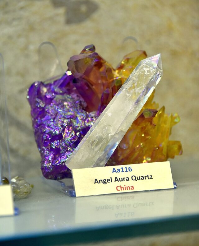 Photograph of iridescent angel aura quartz crystals with a metallic surface treatment