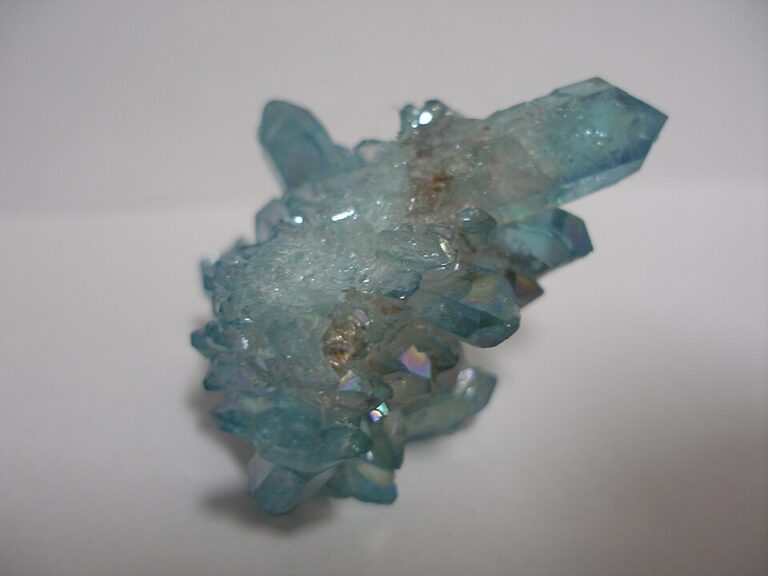 Aqua aura quartz with blue iridescent metallic coating on natural quartz crystals
