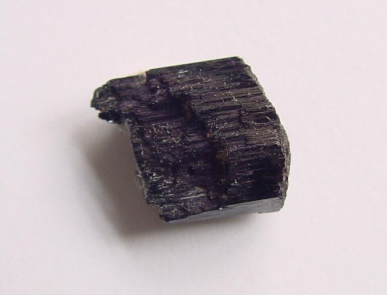 Natural arfvedsonite amphibole mineral specimen with dark crystalline formations