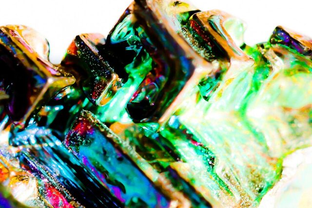 Photograph of iridescent crystallized bismuth showing its characteristic stepped crystal form