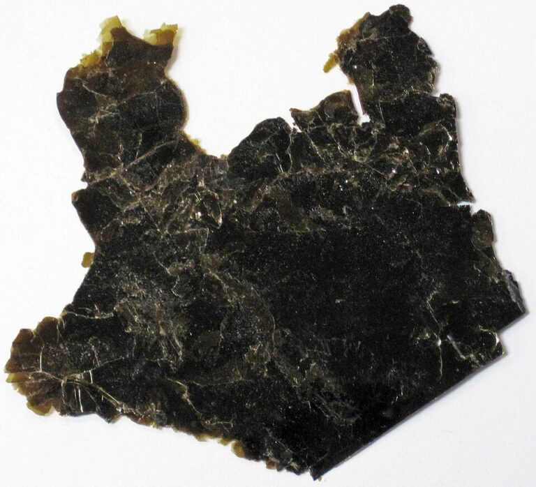 Black biotite mica mineral specimen showing layered crystalline sheets