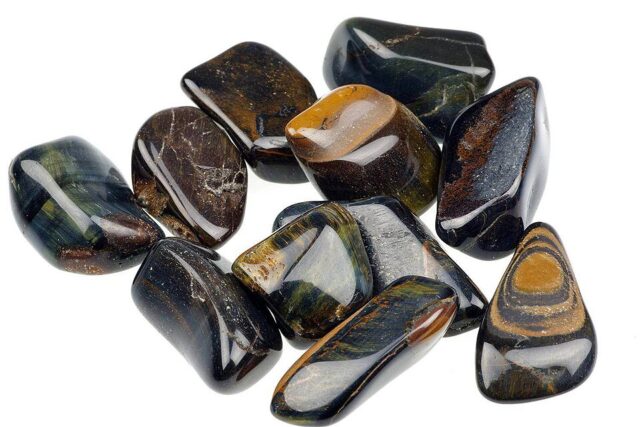 Polished blue tiger eye or hawk eye quartz gemstone with dark blue chatoyancy