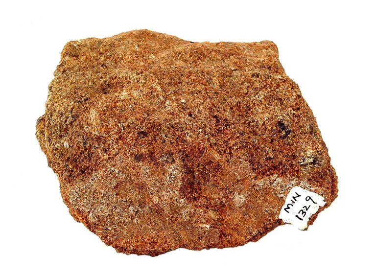 Natural bronzite mineral specimen with muscovite showing bronze-brown crystalline surfaces