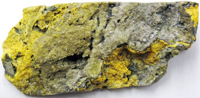 Natural yellow and black sulfidic travertine from Java, marketed as Bumblebee Jasper