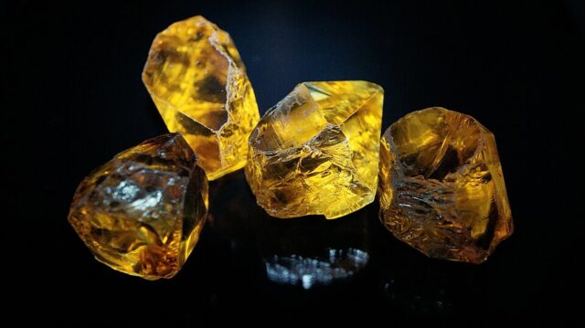 Natural rough yellow citrine quartz crystals from Brazil illustrating citrine meaning
