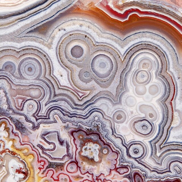 Close-up photograph of banded Crazy Lace Agate mineral from Chihuahua Mexico