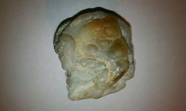 Uncut natural fire agate specimen from New Mexico, showing fire agate mineral texture