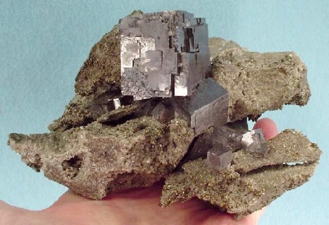Metallic galena lead sulfide crystals in a natural mineral specimen, galena meaning and properties