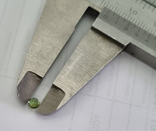 Natural Brazilian green tourmaline crystal specimen illustrating green tourmaline meaning and properties