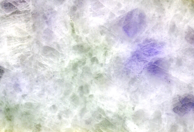 Natural lavender jadeite jade from Myanmar showing pale purple and white mineral pattern