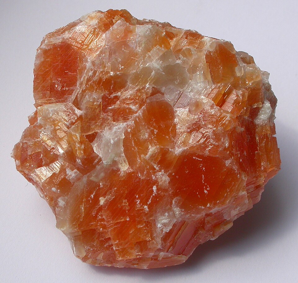 Orange calcite mineral specimen with bright orange crystalline structure