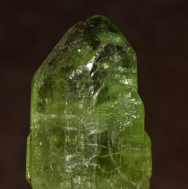Natural bright green peridot olivine gemstone crystal from Pakistan