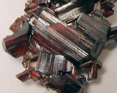 Natural rutile titanium dioxide mineral crystals showing elongated crystal habit