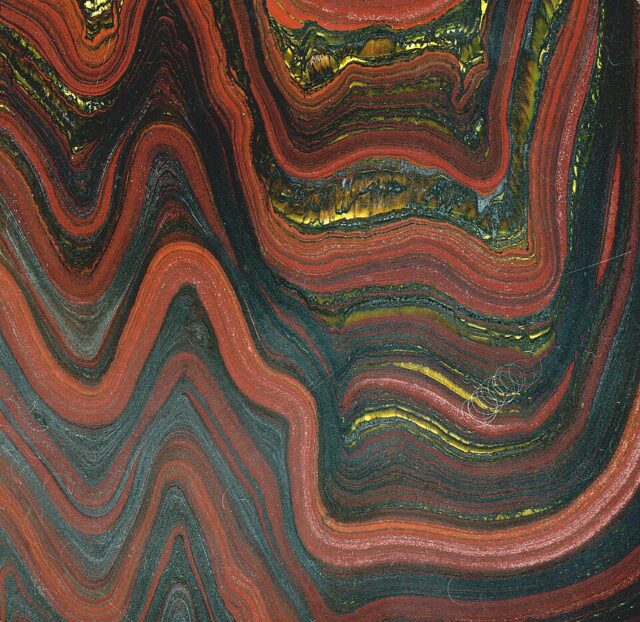 Natural folded tiger iron banded iron formation with golden tiger eye layers from Western Australia