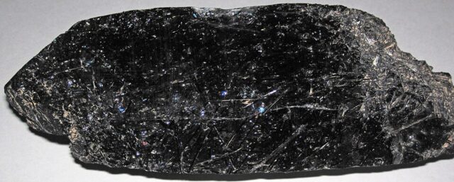 Natural quartz crystal with abundant black needle-shaped tourmaline inclusions